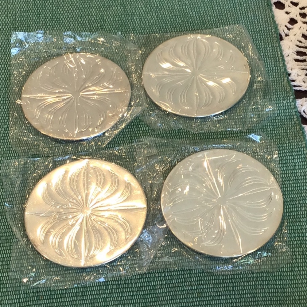 Vintage Silver Plated set of 4 Coasters.
